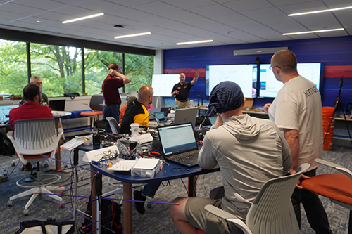 An instructor is helping Teachers Institute participants.